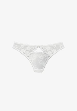 White lace thong featuring floral patterns, semi-sheer fabric, scalloped edges, and a cutout design at the front. Soft waistband.
