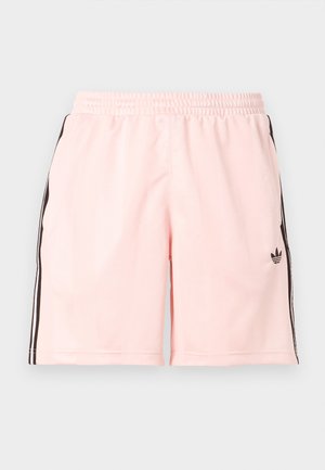 Ροζ αθλητικό σορτς από απαλό ύφασμα, με μαύρες πλευρικές ρίγες και μικρό λογότυπο στην κάτω αριστερή πλευρά. Ελαστική μέση.