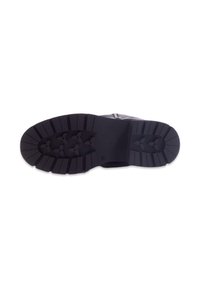 Semelle en caoutchouc noir avec un motif de semelle texturé, comportant de profondes rainures et un design plat pour la stabilité. Pas de marquage ou d'accents visibles.