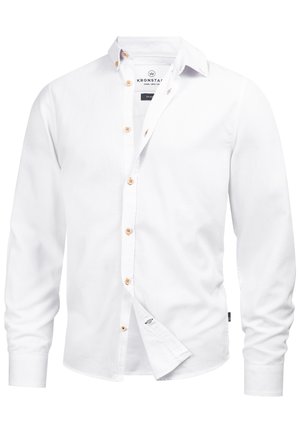 White long-sleeve button-up shirt in cotton fabric. Features brown buttons, a classic collar, and a small logo on the hem.