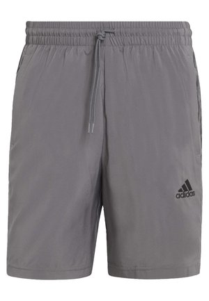 Szare szorty Adidas z elastycznym paskiem, sznurkiem, bocznymi kieszeniami oraz logo Adidas na dolnej prawej nodze.