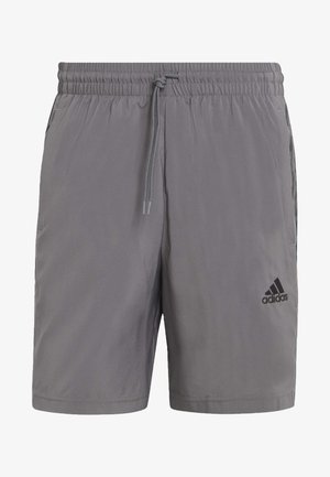 Graue Adidas-Shorts mit elastischem Bund, Kordelzug, Seitentaschen und Adidas-Logo am unteren rechten Bein.