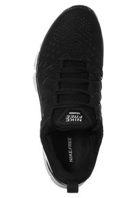 Nike Free Trainer neri con parte superiore testurizzata, collo imbottito, sistema di allacciatura prominente e logo bianco sulla linguetta e sulla soletta.