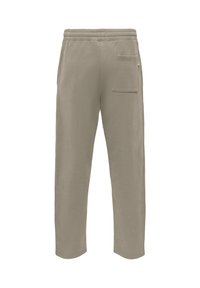 Pantalon de survêtement beige clair avec une taille élastique, des jambes droites et une seule poche arrière. Tissu doux avec une texture lisse.