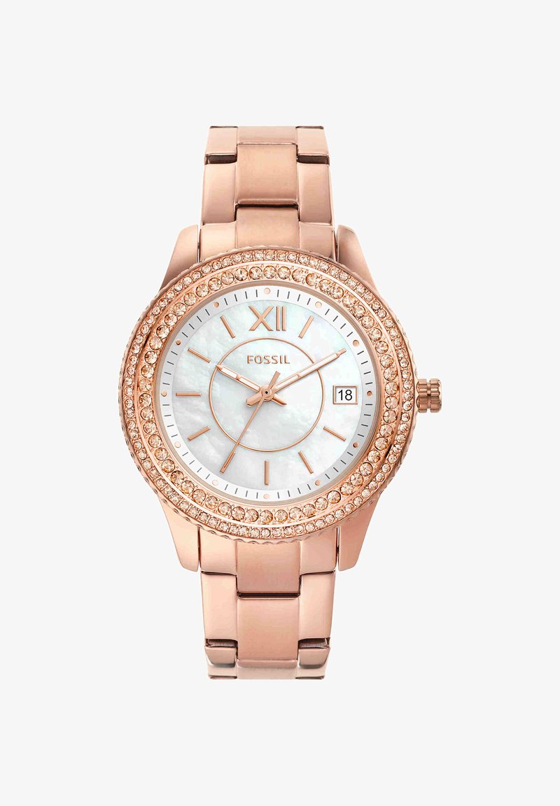 Rose gold Fossil wristwatch with crystal-studded bezel, white mother-of-pearl dial, Roman numeral XII, and date window showing 18.