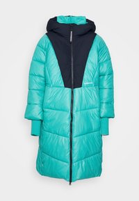 Long manteau d'hiver matelassé bleu sarcelle et noir avec capuche, fermeture éclair devant et poignets allongés pour plus de chaleur.