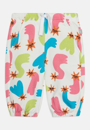 Cotton jogger pants with an elastic waistband, featuring a colorful pattern of abstract hand shapes and smiling sun designs on a white background.