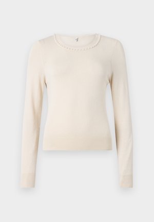 Krém színű, hosszú ujjú pulóver kerek nyakkal, gyöngy díszítéssel a gallér körül, valamint bordázott mandzsettákkal és aljjal. Puha tapintású.