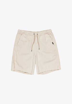 Pantaloni corti beige chiaro con vita elastica e cordino. Presentano tasche laterali, una texture a coste e un'etichetta del marchio nera sul lato.