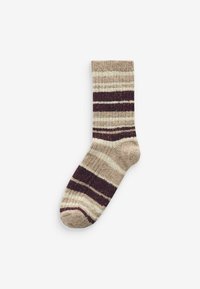 Stribede sokker i en blanding af beige, creme og mørk burgunder farver. Ribbet tekstur med rund tå og forstærket hæl.