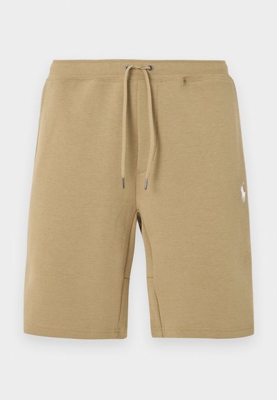 Μπεζ βαμβακερά σορτς με κορδόνι στη μέση και λευκό κεντημένο λογότυπο στο δεξί μηρό.