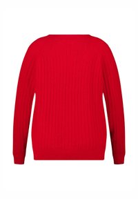 Rode geribbelde trui met lange mouwen en een ronde halslijn. De textuur is zacht met verticale breipatronen door de hele trui.