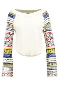 Crochet-tyylinen neulepaita, jossa on valkoinen vartalo ja värikkäät, siniset, keltaiset, mustat ja vaaleanpunaiset raidat pitkissä hihoissa. Pyöreä pääntie.