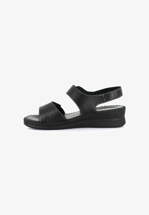 Sandalo nero in pelle con punta aperta, suola cucita, cinturino regolabile alla caviglia e tacco basso a zeppa per uso casual.