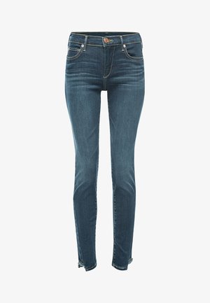 Donkerblauwe denim jeans met een fitted ontwerp, vijf-zakkenstijl, knoopsluiting bij de taille en rafelige zoomaccenten bij de enkels.