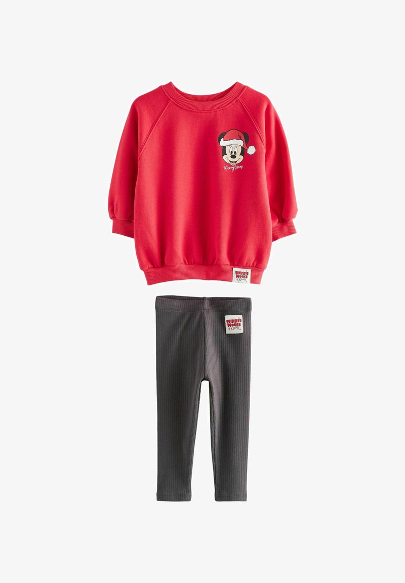Red sweatshirt with rounded hem and elastic cuffs, featuring a cartoon character and text. Grey ribbed leggings with label on waistband.