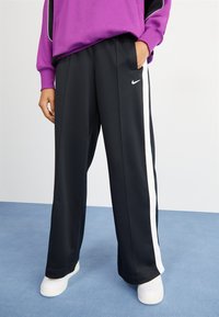 Nike Sportswear PANT - Tracksuit bottoms - black/white