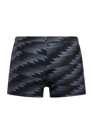 Zwembroek in een zwart-grijs zigzagpatroon, gemaakt van rekbare stof, met een nauwsluitend ontwerp en een gladde textuur.