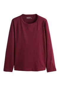 T-shirt à manches longues col rond uni couleur bordeaux, design simple avec coutures visibles à l'encolure et aux poignets.
