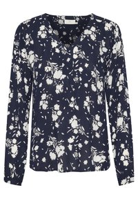 Blouse bleu marine à manches longues avec imprimé floral blanc et col en V.