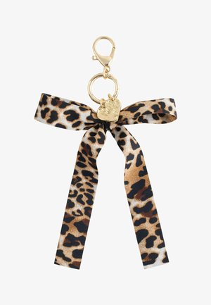 Gold keychain with a leopard print fabric bow and a small hammered gold heart charm attached to a lobster clasp.