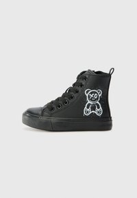 Black high-top sneakers made of synthetic material, featuring a white bear graphic on the side, thick black rubber sole, and round laces.