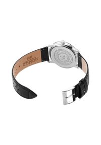 Bracelet de montre en cuir noir avec surface texturée, boîtier en acier inoxydable argenté et fond gravé. Fermeture à boucle avec le nom de la marque visible.