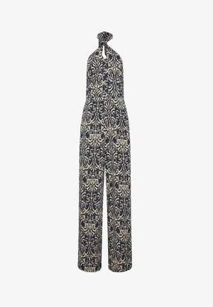 Ærmeløs sort og beige mønstret jumpsuit med høj hals med bindebånd og vide ben, med et indviklet symmetrisk design.