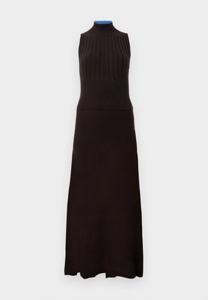 Sleeveless, dark brown knit dress with ribbed top and fitted bodice, flowing into a long, smooth skirt for a streamlined silhouette.