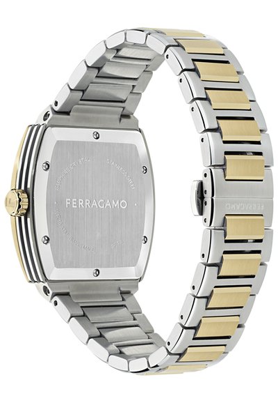 Srebrno-złoty zegarek ze stali nierdzewnej z prostokątną kopertą i szczotkowanymi teksturami. Posiada szafirowe szkło i wygrawerowaną nazwę marki.