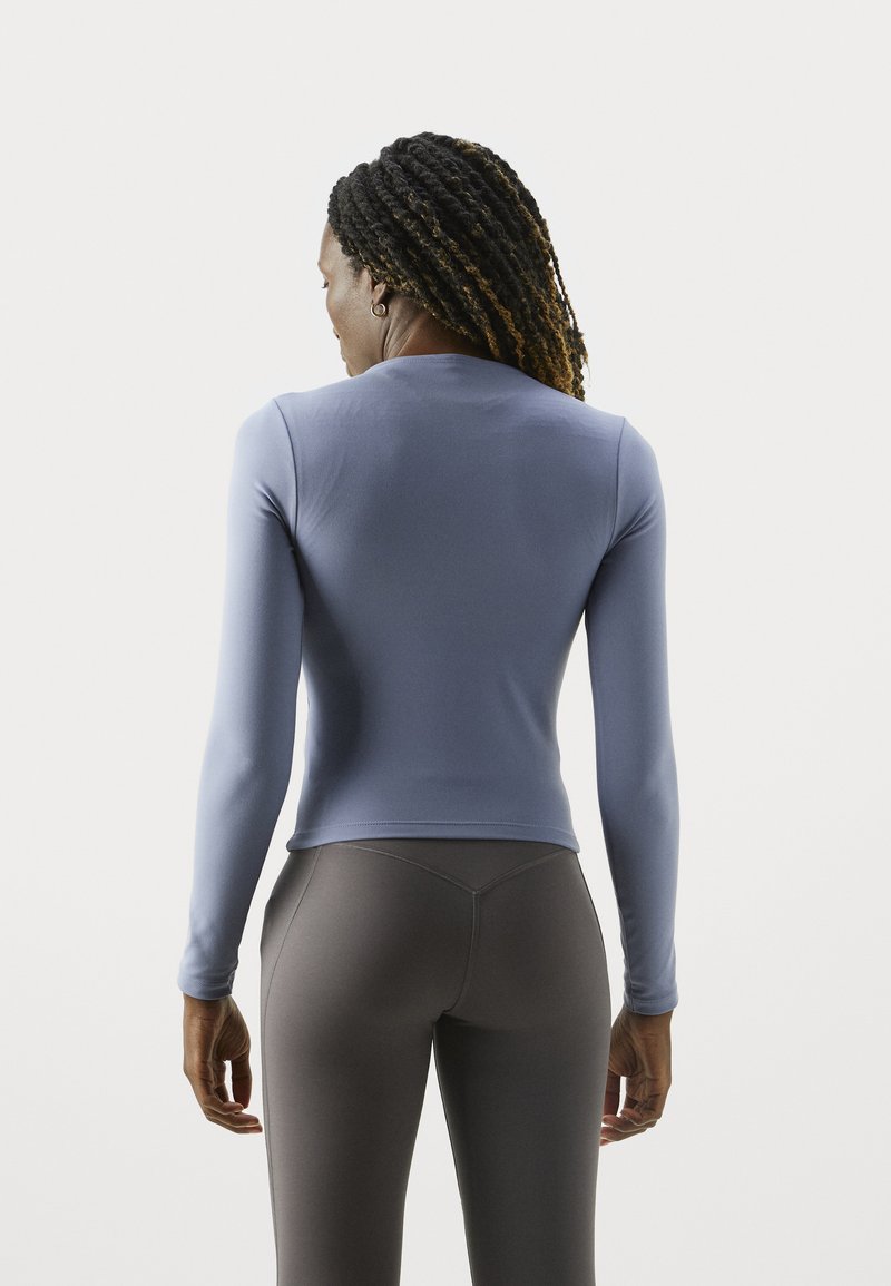 Gilet manches longues ajusté bleu marine femme