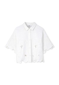 Camicia in lino bianca a lunghezza cropped con chiusura a bottoni e orlo ondulato. Presenta motivi a fiori traforati e design ricamati sui pannelli frontali.