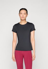 Black short-sleeve athletic shirt with round neckline and fitted design, made from smooth fabric. Features a subtle logo in front.