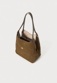 Brown suede tote bag with a smooth texture, dual handles, and gold-tone hardware. Features an open top and an interior zipped pocket.