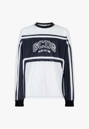 Maglietta a maniche lunghe in bianco e nero con testo "GCDS Milano Italia 1988" e strisce orizzontali e verticali sul petto e sulle maniche.