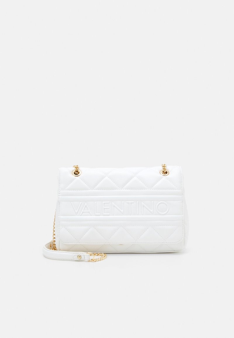 White quilted handbag with embossed "Valentino" branding. Features gold hardware and a chain strap, with a rectangular shape and smooth texture.