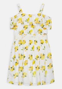 Weißes Strandkleid mit Zitronen- und Blumenmuster, R�üschenausschnitten an den Schultern und einem eng anliegenden Oberteil mit einer Spitzenakzent an der Taille.