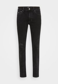 Smala svarta jeans i denim, med ett förstörs knä med abrasioner, samt standard fram- och bakfickor.