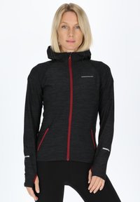 Black zip-up hoodie with a hood, red accents, two side pockets, and reflective detailing. Made from a textured, lightweight fabric.