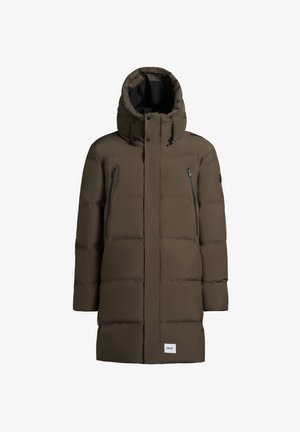 Olive green puffer coat with a tall hood, two front zip pockets, and a branded patch. Features a boxy silhouette and stitched panel design.