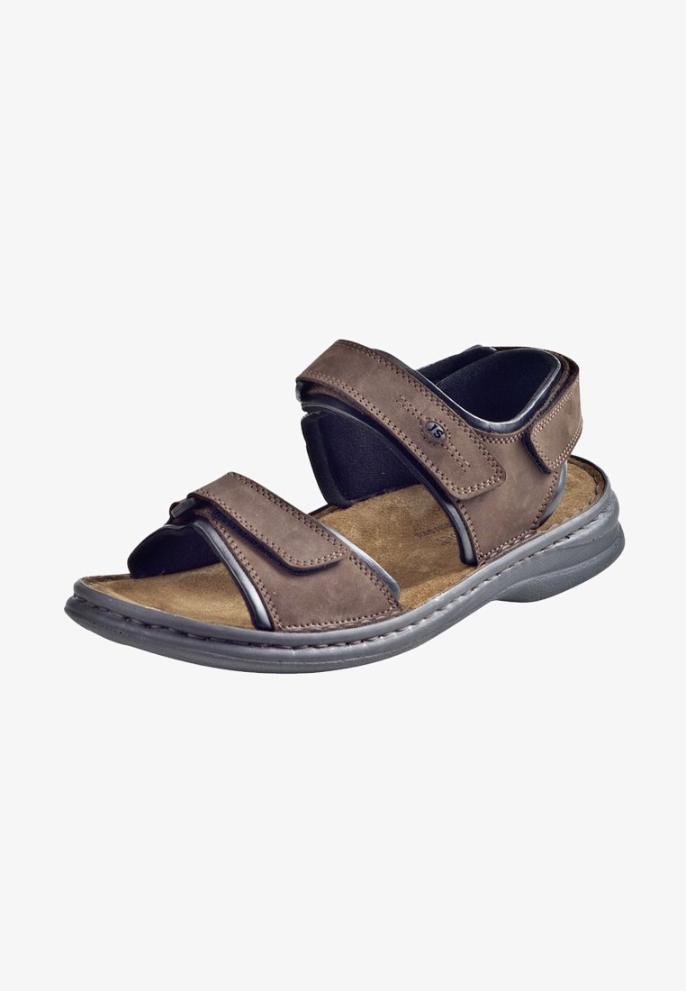 Brune lædersandal med to justerbare Velcro-stropper, polstret sål og en fleksibel gummisål. Har syninger som pynt og et åbent design.