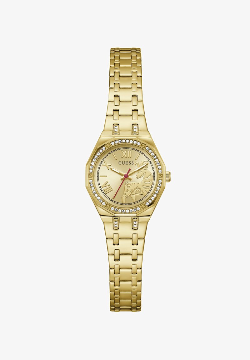 Ρολόι χειρός Gold Guess με στεφάνη διακοσμημένη με κρύσταλλα, ρωμαϊκούς αριθμούς, κόκκινο δείκτη δευτερολέπτου και χαραγμένο σχέδιο κατσίκας στο καντράν.