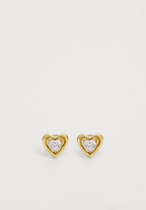 Gold heart-shaped earrings with a smooth finish, featuring clear, sparkling gemstones at the center and a raised, outlined design.