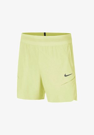Pantalones cortos deportivos de color amarillo claro con una cinturilla de malla, bolsillos laterales y un logo de swoosh de Nike en gris oscuro. Tejido suave y ligero.