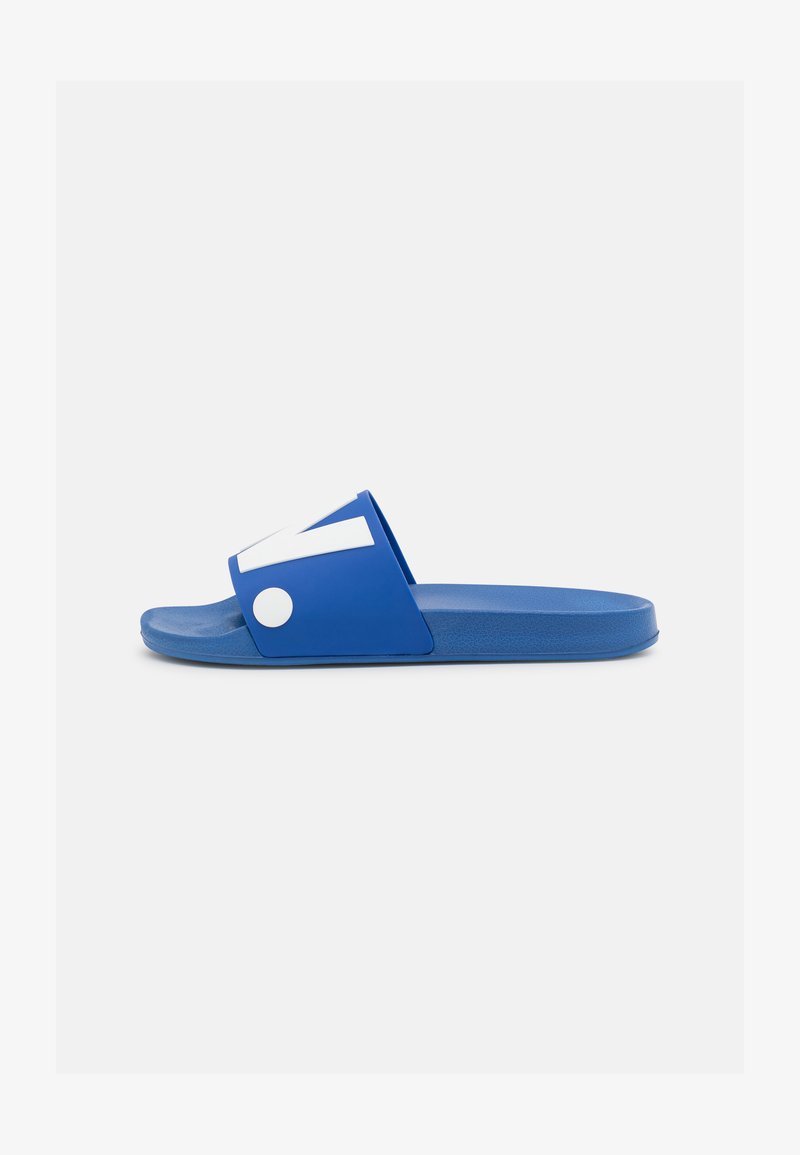 Blue slide sandal made of rubber. Features a wide strap with white accents and a textured sole, designed for comfort and stability.