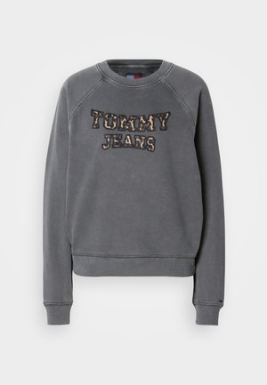 Grijze sweatshirt met een ronde hals, raglanmouwen en "TOMMY JEANS" geborduurd in een luipaardprint ontwerp. Zacht materiaal met geribbelde manchetten.