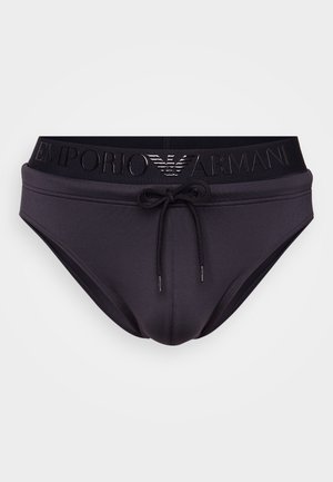 Schwarze Schwimmshorts mit Kordelzug und einem breiten Bund, der mit dem geprägten Emporio Armani-Logo versehen ist. Glatt, dehnbares Material, enganliegendes Design.