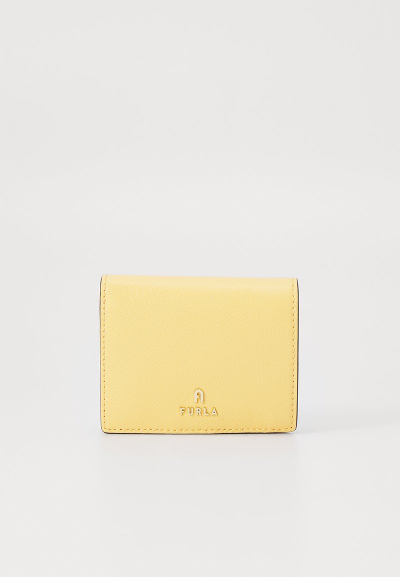 Yellow leather wallet with a textured finish, featuring a logo in gold at the bottom. Compact rectangular design with a fold-over closure.