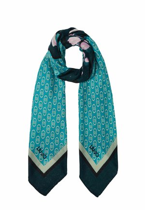 Szalik w kolorze morskim z powtarzającym się jasnoniebieskim wzorem, z akcentami kwiatowymi i kontrastującą ciemną obwódką o subtelnym połysku. Kształt prostokątny.