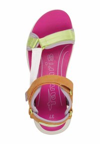 Colorful sandal featuring bright pink insole, green and yellow straps, and brown suede accents. Adjustable design with rubber outsole.